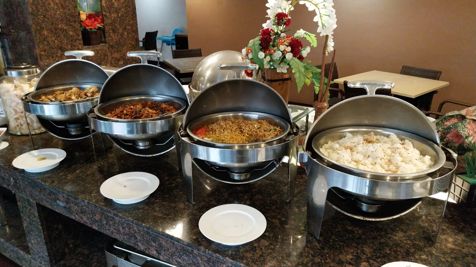 Chafing dishes with hot food on a banquet buffet